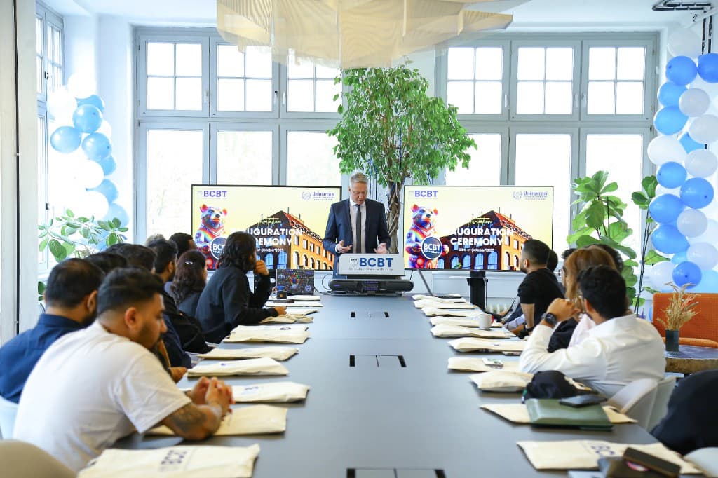 Inauguration ceremony at Berlin College with students and BCBT branding